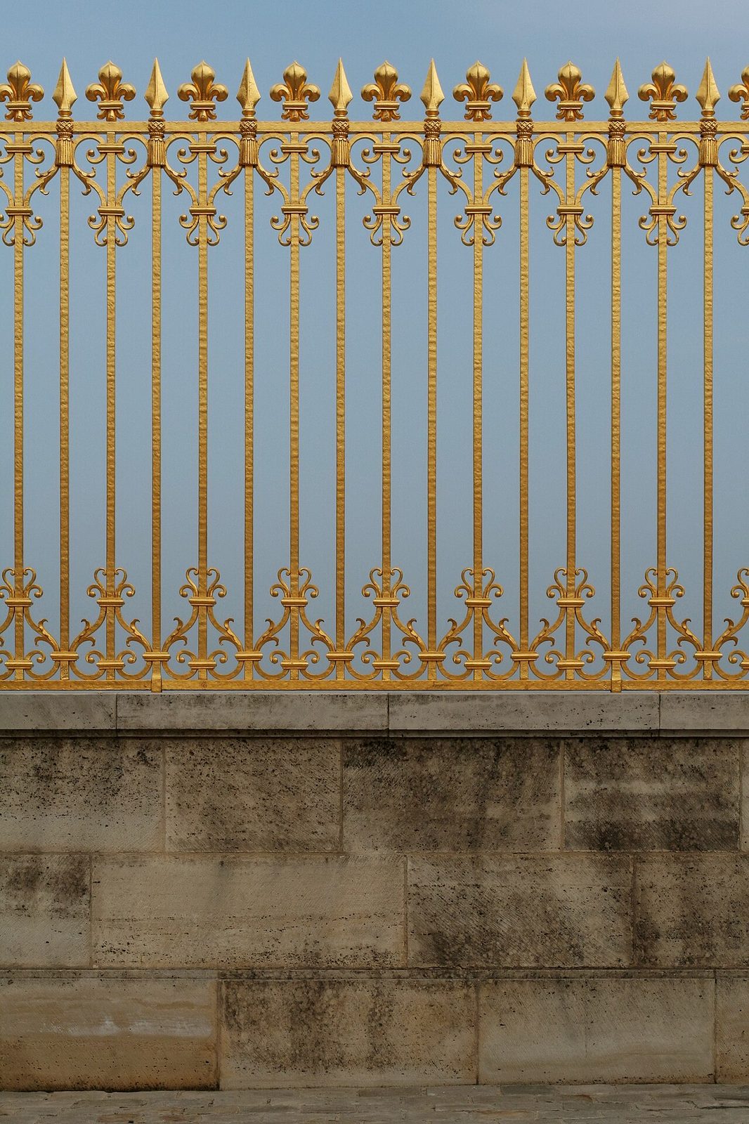 The reconstructed golden Grille Royale gates of the Palace of Versailles, covered in 100,000 gold leaf sheets